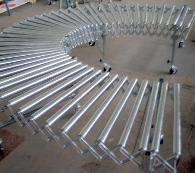 Expanding flexible conveyor with steel rollers.