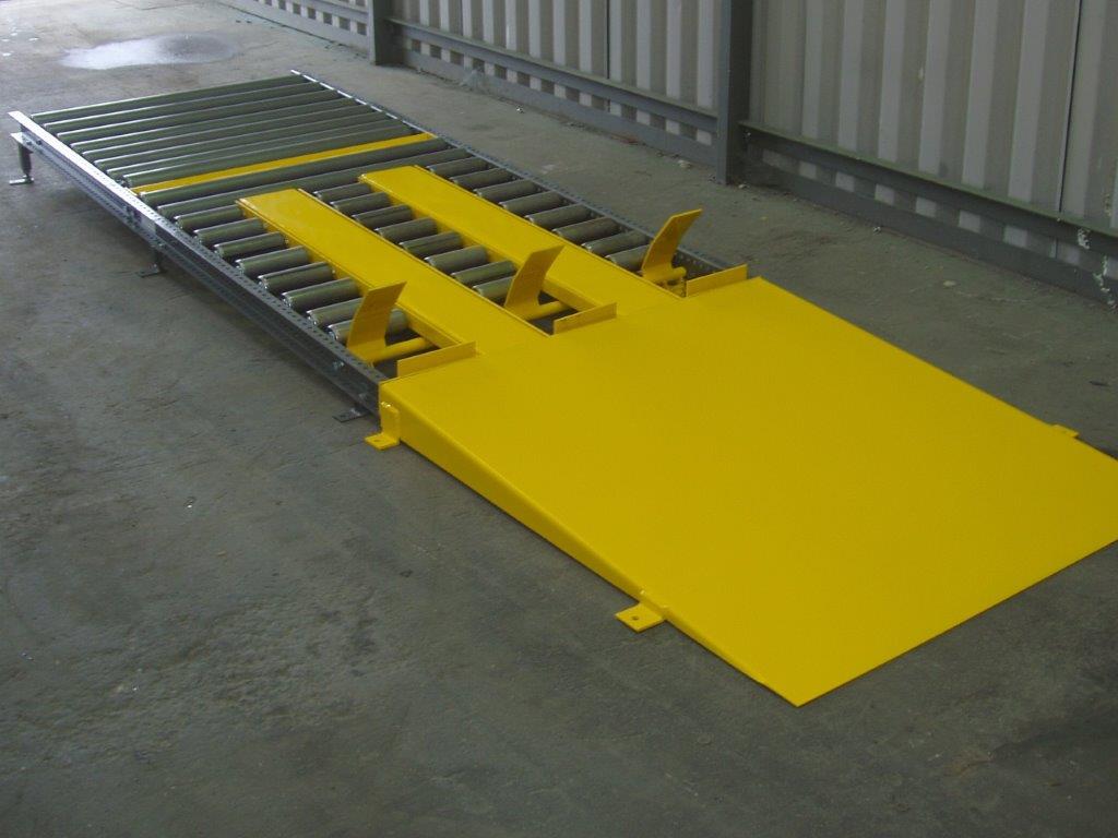 Ground level gravity roller pallet conveyor.
