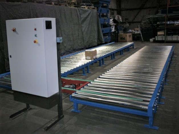 Powered roller conveyor for moving pallets. 