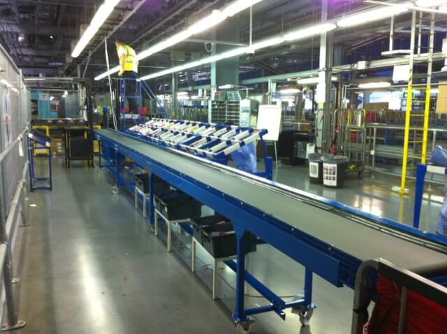 Long heavy duty belt conveyor in a factory