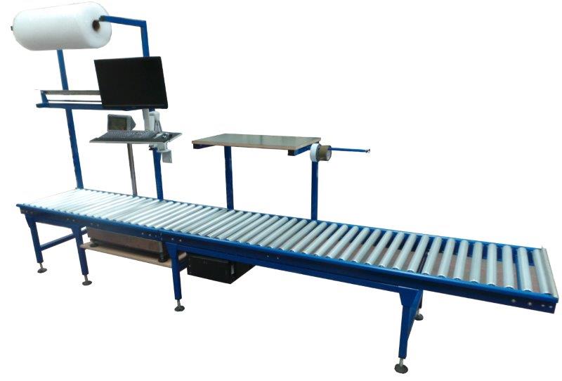 Gravity conveyor system integrated into workstation. 